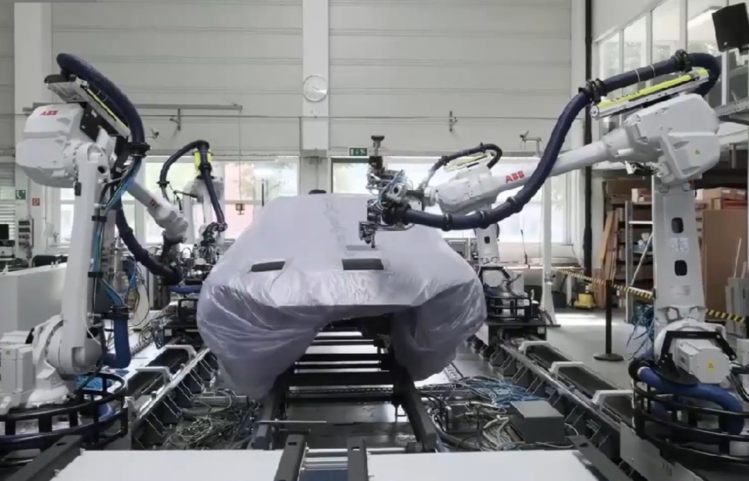 robotic paint repair with 4 ABB robots and 3M paint-repair hardware - programmed with AUTOMAPPPS